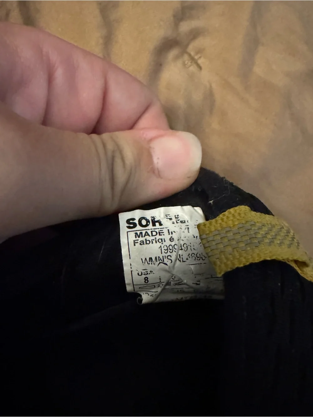 Sorel Black Slip-On Athletic Sneakers with White Soles and Yellow Heel Tab